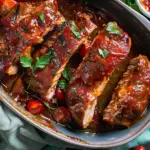 Juicy BBQ ribs with a rich glaze, served with a side of coleslaw.