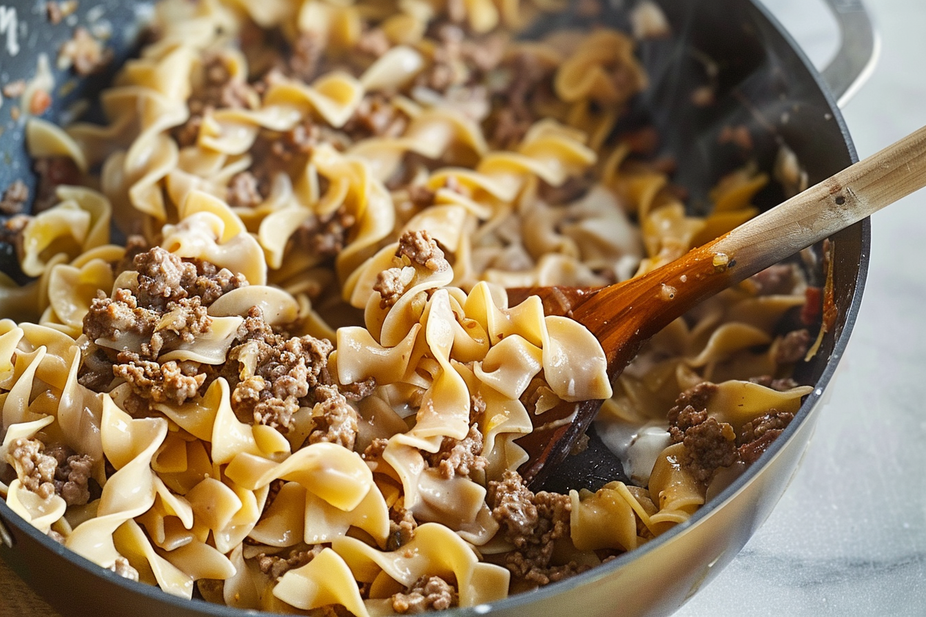 A delicious plate of Beef Stroganoff served over egg noodles with a creamy mushroom sauce.