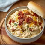 Alt text: "A hearty serving of Creamy Crockpot Crack Chicken garnished with chopped green onions, showcasing the rich and savory Crack Chicken Crockpot Recipe."