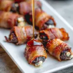 Alt text: "Bacon-wrapped dates recipe, featuring sweet dates wrapped in crispy bacon with a honey drizzle, served on a white plate."